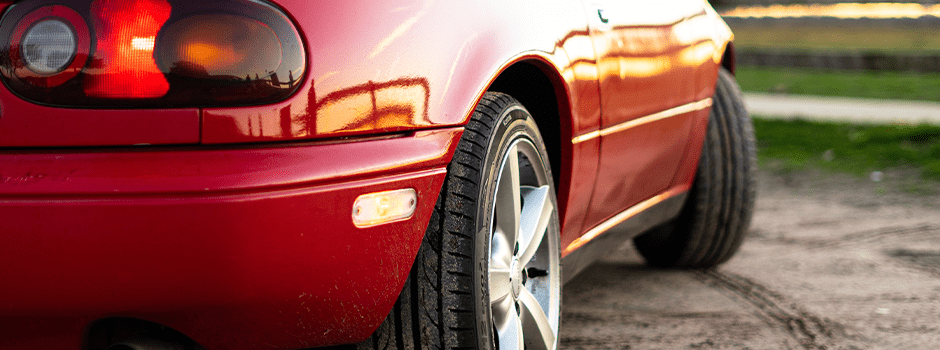 Red vehicle showing close up on wheels